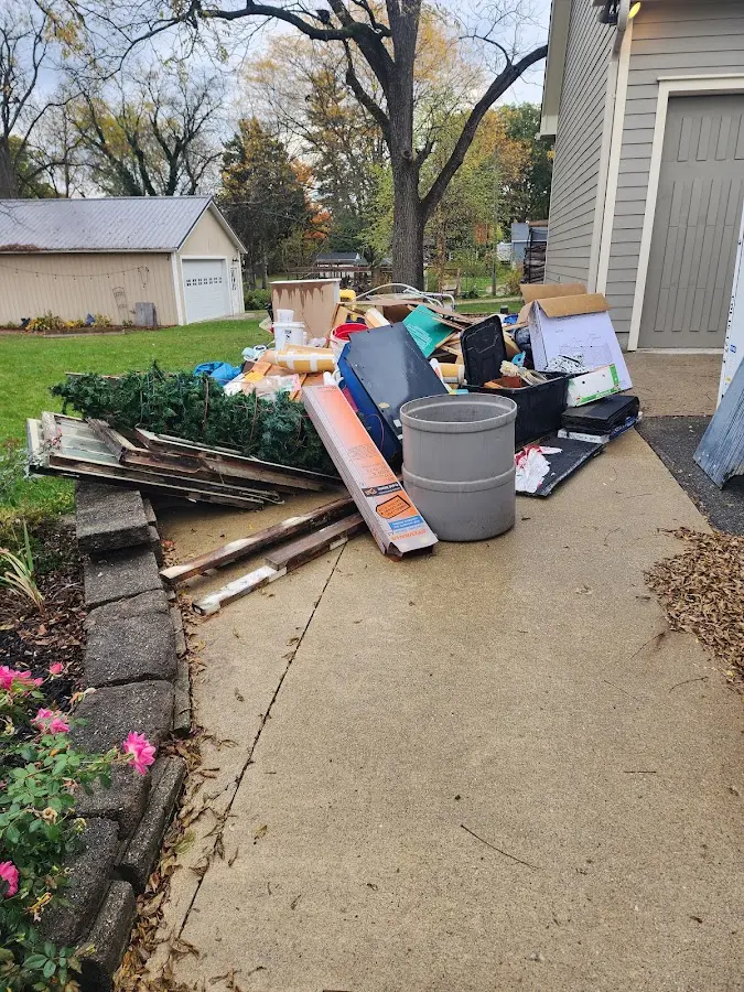Dumpster being loaded with debris for 3 Yard Dumpster Rental in Goleta